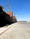 A giant ship in the anchorage with huge cranes