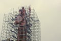 Giant Shiva statue in scaffolding for restoration near entrance to famous Hindu temple at Grand Bassin lake Royalty Free Stock Photo