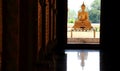 a giant sitting statue Buddha images behind the doors in Thai temples