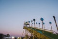 Giant slide ride in background of blue sky in Decatur during sunset