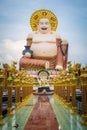 Giant smiling or happy buddha statue in buddhist temple wat pl Royalty Free Stock Photo