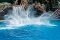 Giant splash of water made by Orcinus Orca, Killer Whale Breaches the water at aquarium in San Diego Sea World California