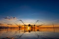 Giant of square dip net with sunrise light and blue sky Royalty Free Stock Photo