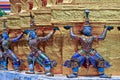 A giant statue carrying a pagoda at Wat Phra Kaew , Bangkok , Thailand