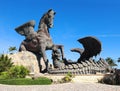 Giant statue of Pegasus defeating a dragon.