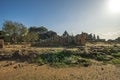 Giant statue of talamone from Zeus temple. And in background view on the town of Agrigento. Royalty Free Stock Photo