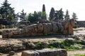 Giant statue of talamone from Zeus temple. And in background view on the town of Agrigento. Royalty Free Stock Photo