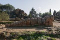 Giant statue of talamone from Zeus temple. And in background view on the town of Agrigento. Royalty Free Stock Photo