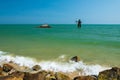 Giant statue on turquoise sea and blue sky in Cha Am, Phetchaburi Royalty Free Stock Photo