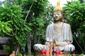 Giant stone buddha decorates an Asian aquatic jungle theme park