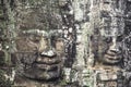 Giant stone faces at Bayon Temple, Angkor Wat, Cambodia. Royalty Free Stock Photo