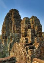 Giant stone faces at Bayon Temple in Cambodia Royalty Free Stock Photo