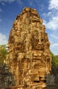 Giant stone faces at Bayon Temple in Cambodia Royalty Free Stock Photo