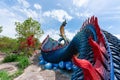 Giant Thai Naga Statue with blue sky clouds in the Phu Manorom Temple, Royalty Free Stock Photo