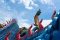 Giant Thai Naga Statue with blue sky clouds in the Phu Manorom Temple, Royalty Free Stock Photo