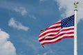 Giant Usa American flag stars and stripes on sky background Royalty Free Stock Photo