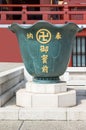 Giant vase with swastika at Senso-ji Buddhist Temple.