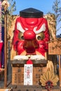 Giant vermilion face of a Japanese Tengu exhibited at the Shimokitazawa Tengu Festival.