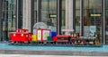 A Giant Vintage Train Toy in a Pool in Manhattan, New York City. Unique Christmas Decoration in Time Warner Building.