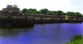 Giant wall and fort battlements with reflection in trench