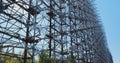 giant wall of metal military antennas of the USSR, a radar arc, an abandoned secret facility in Chernobyl, Ukraine.