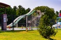 Giant water slide in a community swimming pool at a park Royalty Free Stock Photo