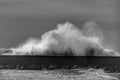 Giant waves breaking on the breakwater and the lighthouse