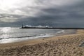 Giant waves breaking on the breakwater and the lighthouse