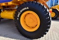Giant wheels and tires on huge mining truck BELAZ with logo BELSHINA JSC production of one of the largest automobile tire