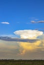 Giant white cloud in the form of a mushroom in blue skies. Royalty Free Stock Photo