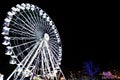 Giant white Ferris wheel in motion. Outdoor attractions. Royalty Free Stock Photo