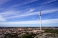 Giant wind turbine in a flat cliffy landscape