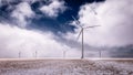 Giant Windmills Spinning Over a Frozen Landscape