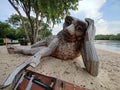 giant wooden gorilla statue at beach