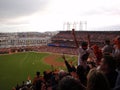 Giants fans throughout the ballpark cheer as they raise hands in