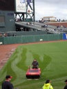 Giants grounds drive water hog across grass to remove water out Royalty Free Stock Photo