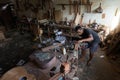 GIANYAR,BALI/INDONESIA-MAY 30 2019: A guitar craftsman is measuring and make sure it is a precision guitar part, in a wooden