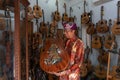 GIANYAR,BALI/INDONESIA-MAY 30 2019: I Wayan Tuges, the owner of the Tuges and Blueberry carving guitar in Guwang, Gianyar Bali,