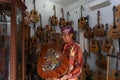 GIANYAR,BALI/INDONESIA-MAY 30 2019: I Wayan Tuges, the owner of the Tuges and Blueberry carving guitar in Guwang, Gianyar Bali,