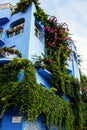 Giardini Naxos blue hotel covered in greenery, Sicily