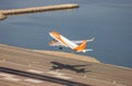 EasyJet Airplane taking off from the airport during morning. Aerial View from Rock of Gibraltar