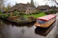 Electric tourist canal boat in the Dutch village canals of Giethoorn