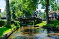 Giethoorn, Netherlands: Landscape view of famous Giethoorn village with canals and rustic thatched roof houses. The beautiful