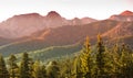 Giewont and Tatra Mountains panorama - autumn sunrise over rocky summits and pine forest hills Royalty Free Stock Photo