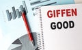 GIFFEN GOOD text on a notebook with pen on a chart background Royalty Free Stock Photo