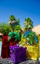 Gift bags and box with ribbon by the swimming pool