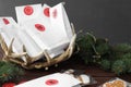 Gift bags, Christmas cookies and fir tree on wooden table. Creating advent calendar Royalty Free Stock Photo