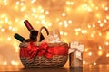 Gift basket with bottles of wine against blurred lights Royalty Free Stock Photo