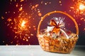 Gift basket with festive sparklers particles Royalty Free Stock Photo