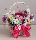 Gift basket with flowers and a bow